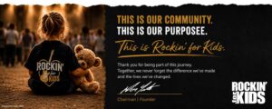 Child holding a teddy bear at a Rockin' for Kids community event with the message "This Is Our Community. This Is Our Purpose."