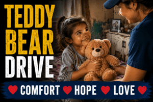 Child receiving a teddy bear from a Rockin' for Kids volunteer during the Teddy Bear Drive, bringing comfort, hope and love to children in need.