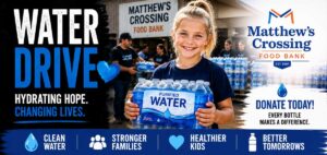 Young girl holding bottled drinking water during the Rockin' for Kids Water Drive supporting Matthew's Crossing Food Bank.