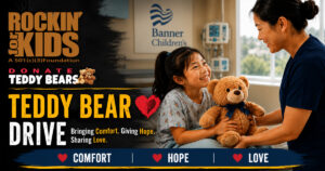 Child receiving a teddy bear through the Rockin' for Kids Teddy Bear Drive program in Arizona's East Valley.